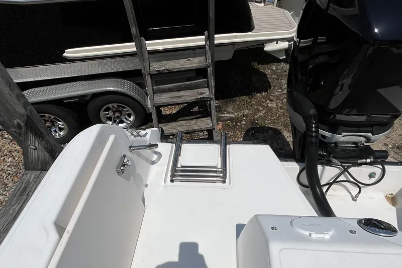 Slide: The Image of 2005 Boston Whaler 210 Ventura boat with ladder and engine detail. - 29
