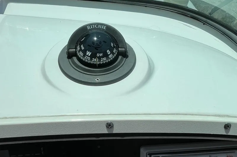 Slide: The Image of Compass on 2005 Boston Whaler 210 Ventura boat dashboard. - 6