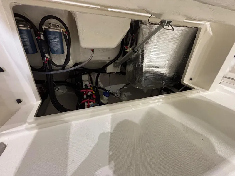 Slide: The Image of 2025 Cobia 285 Center Console boat interior wiring and components. - 23