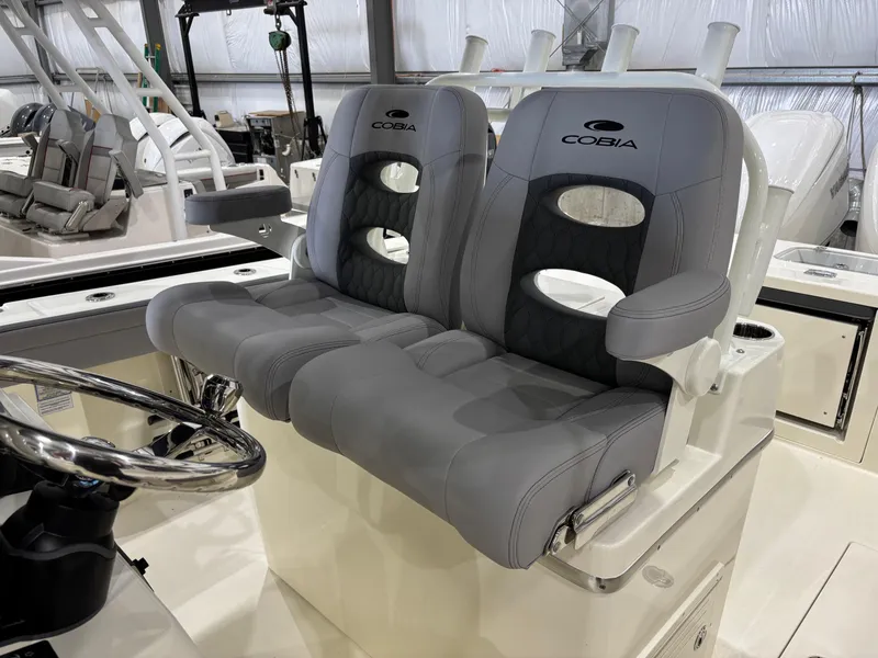 Slide: The Image of 2025 Cobia 285 Center Console boat seats, featuring sleek gray upholstery and modern design. - 8