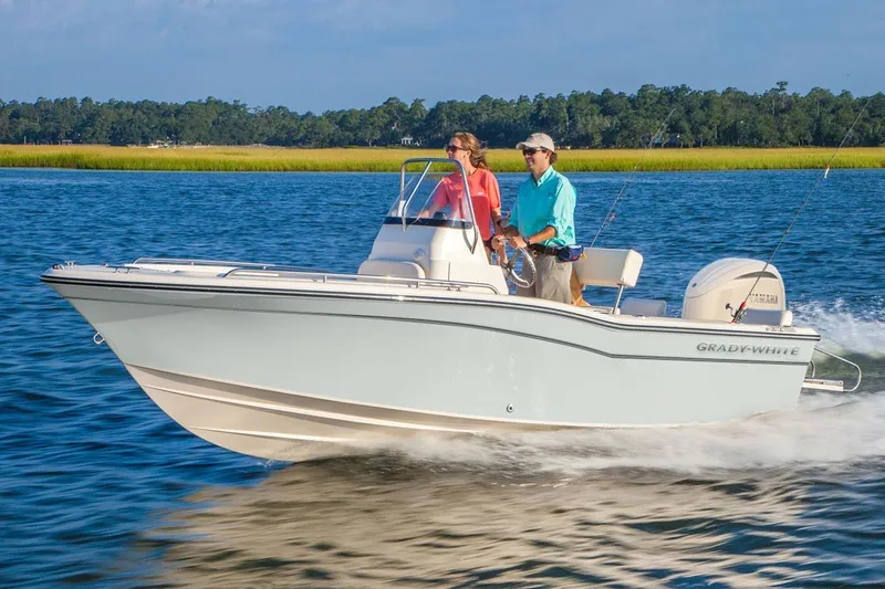 The Image of 2026 Grady-White Fisherman 180 boat cruising on a scenic lake. - 1