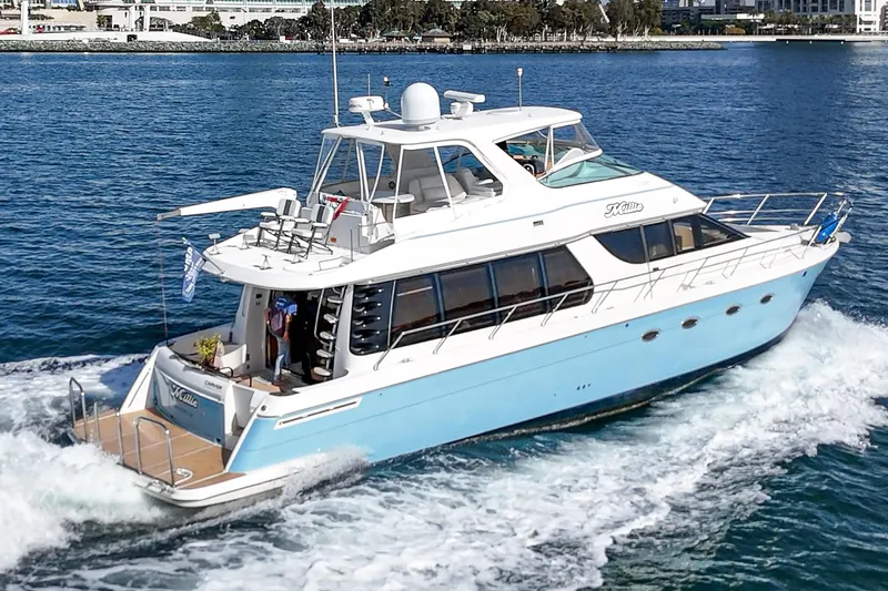 Slide: The Image of 2003 Carver 570 Voyager Pilothouse yacht cruising on blue water. - 12