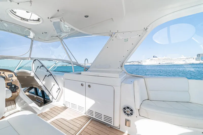 Slide: The Image of 2003 Carver 570 Voyager Pilothouse interior with ocean view and luxurious seating. - 23