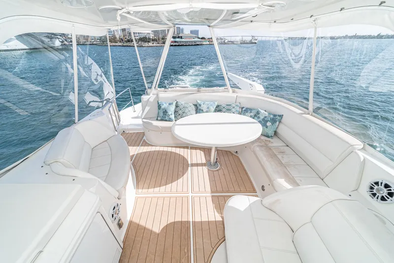 Slide: The Image of Luxurious 2003 Carver 570 Voyager Pilothouse yacht interior with elegant seating and ocean view. - 24