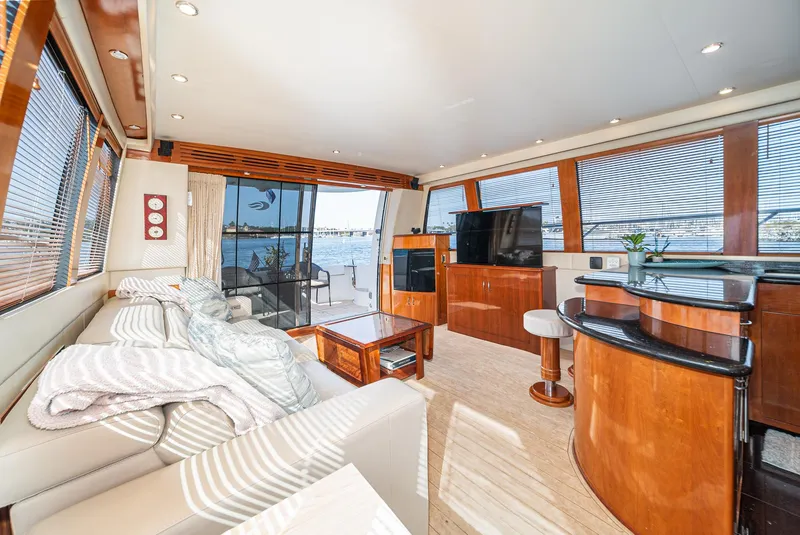 Slide: The Image of Luxurious interior of 2003 Carver 570 Voyager Pilothouse yacht with modern furnishings and scenic views. - 36