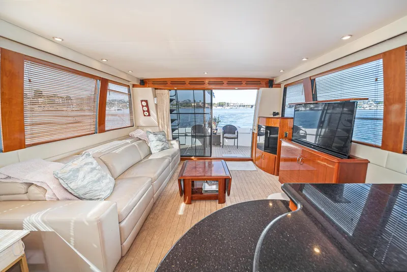 Slide: The Image of Luxurious interior of 2003 Carver 570 Voyager Pilothouse yacht with elegant furnishings and waterfront view. - 40