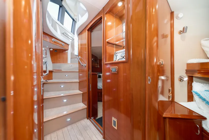 Slide: The Image of Luxurious interior of 2003 Carver 570 Voyager Pilothouse with polished wood and elegant staircase. - 41