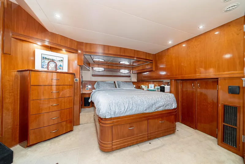 Slide: The Image of Luxurious bedroom interior of 2003 Carver 570 Voyager Pilothouse yacht with wood finish. - 46