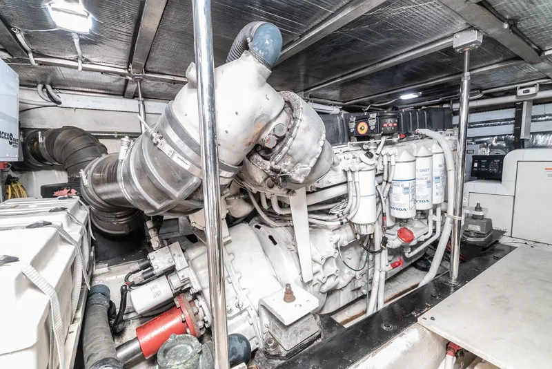 Slide: The Image of Engine room of 2003 Carver 570 Voyager Pilothouse with visible machinery and components. - 47