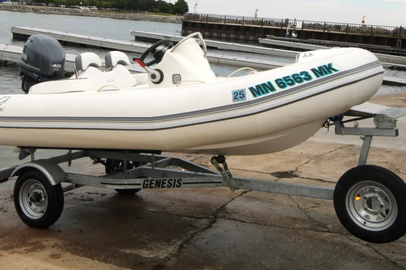 The Image of 2022 Zodiac Yachtline 360DL NEO on Genesis trailer by waterfront. - 0