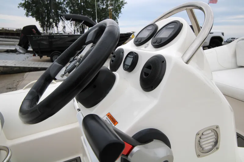 Slide: The Image of 2022 Zodiac Yachtline 360DL NEO dashboard with steering wheel and controls. - 5