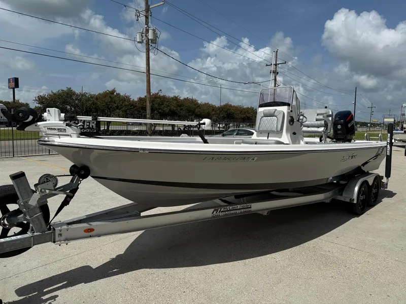 Slide: The Image of 2022 Blue Wave 2400 PureBay boat with Suzuki outboard motor on a trailer. - 4