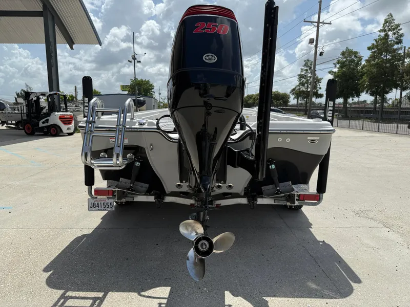 Slide: The Image of 2022 Blue Wave 2400 PureBay boat with Suzuki engine on a trailer. - 6