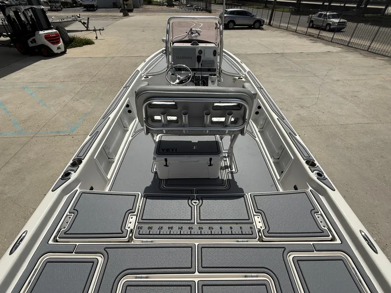 Slide: The Image of 2022 Blue Wave 2400 PureBay boat interior with modern console and seating. - 8