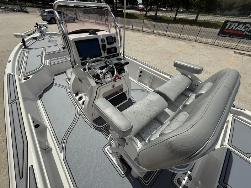 Slide: The Image of 2022 Blue Wave 2400 PureBay boat deck with seating and trolling motor. - 9