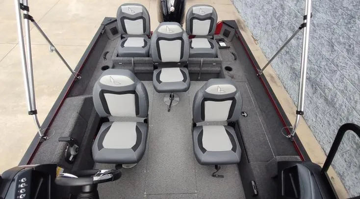 Slide: The Image of 2023 Lowe FM 1775 boat interior with six gray and white seats, spacious layout. - 12
