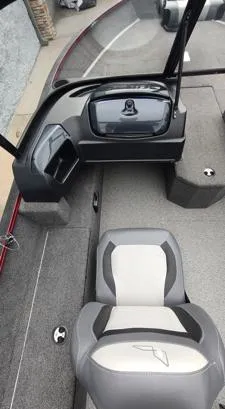 Slide: The Image of 2023 Lowe FM 1775 boat interior with gray seating and console. - 16