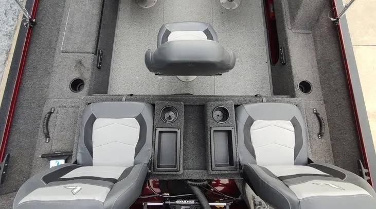 Slide: The Image of 2023 Lowe FM 1775 boat interior with three gray seats and storage compartments. - 18