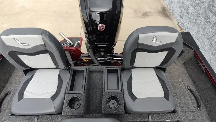 Slide: The Image of 2023 Lowe FM 1775 boat interior with dual seats and motor. - 21