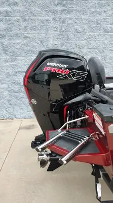 Slide: The Image of 2023 Lowe FM 1775 boat with Mercury Pro XS engine, parked on concrete. - 25