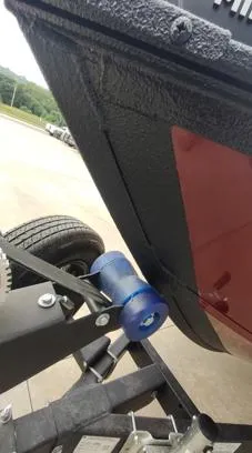 Slide: The Image of 2023 Lowe FM 1775 boat trailer with blue roller and black hull. - 4