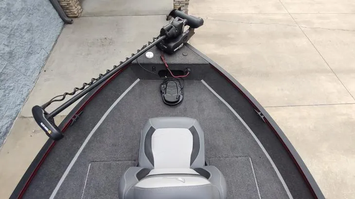 Slide: The Image of 2023 Lowe FM 1775 boat interior with trolling motor and seating. - 6