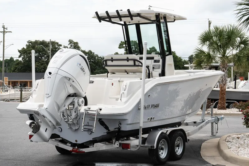 Slide: The Image of 2026 Sailfish 232 CC boat on trailer, featuring powerful outboard motor. - 6