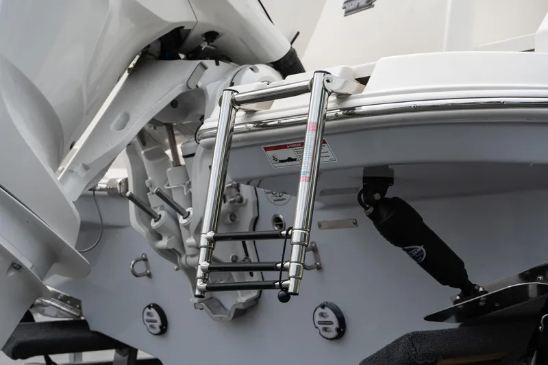 Slide: The Image of Stainless steel ladder on 2026 Sailfish 232 CC boat, rear view. - 8