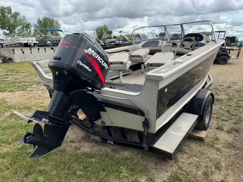 Slide: The Image of 2000 Sylvan 1900 Excursion boat with Mercury OptiMax engine on a trailer. - 4