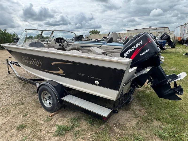 Slide: The Image of 2000 Sylvan 1900 Excursion boat with Mercury OptiMax engine on trailer. - 5