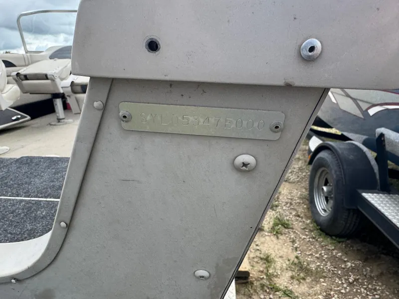 Slide: The Image of Hull identification number on a 2000 Sylvan 1900 Excursion boat, parked on a trailer. - 7