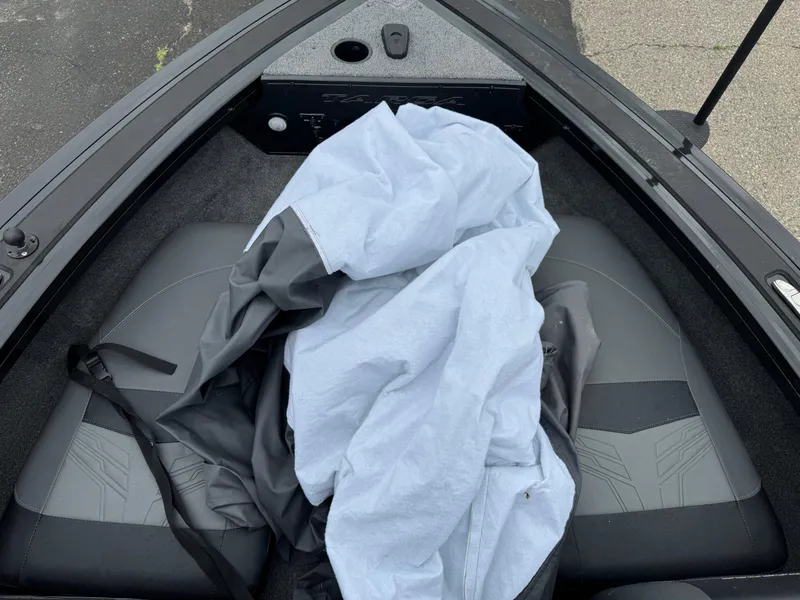 Slide: The Image of 2023 Tracker Targa V-18 WT boat interior with seats and a tarp. - 10