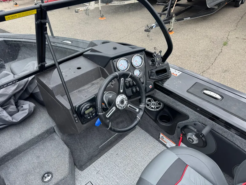 Slide: The Image of 2023 Tracker Targa V-18 WT boat cockpit with steering wheel and instrument panel. - 7