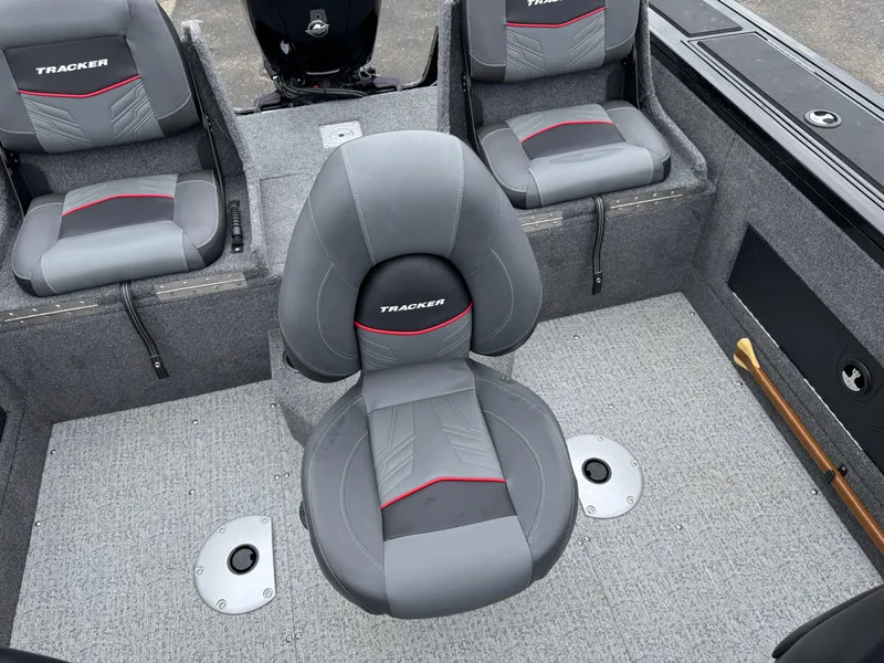Slide: The Image of 2023 Tracker Targa V-18 WT boat interior with gray and red seating. - 9