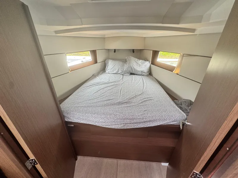 Slide: The Image of Interior of 2023 Beneteau Oceanis 38.1 yacht with navigation equipment and wooden finish. - 21