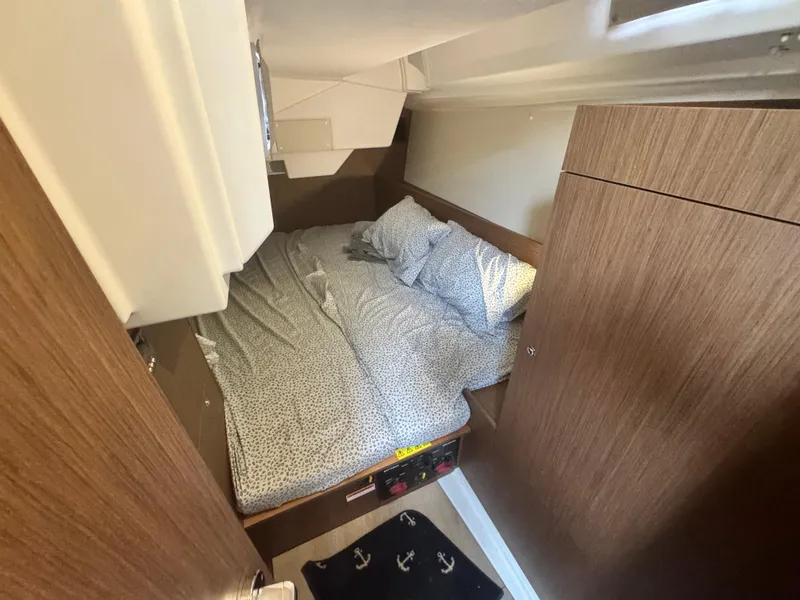 Slide: The Image of Modern kitchen in 2023 Beneteau Oceanis 38.1 yacht with stove, sink, and microwave. - 25