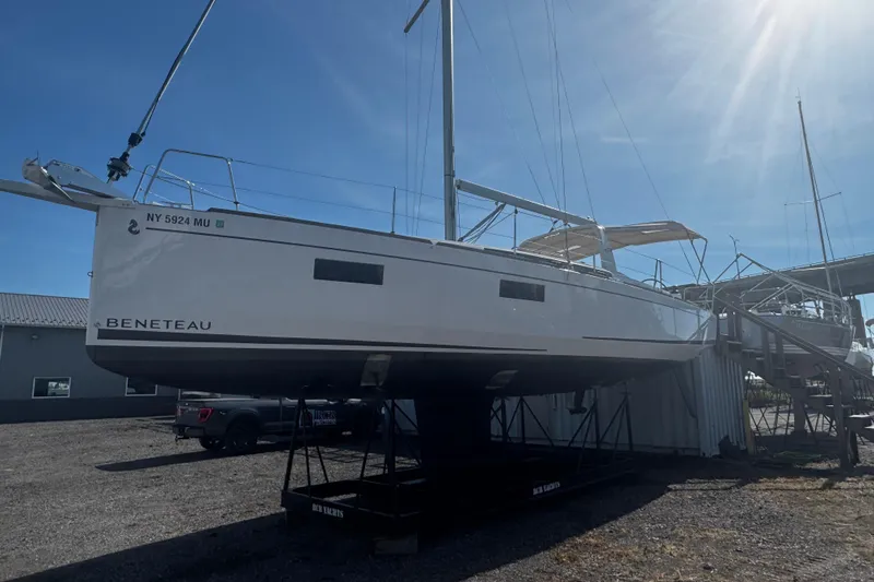 Slide: The Image of 2023 Beneteau Oceanis 38.1 sailboat docked at marina, side view. - 3
