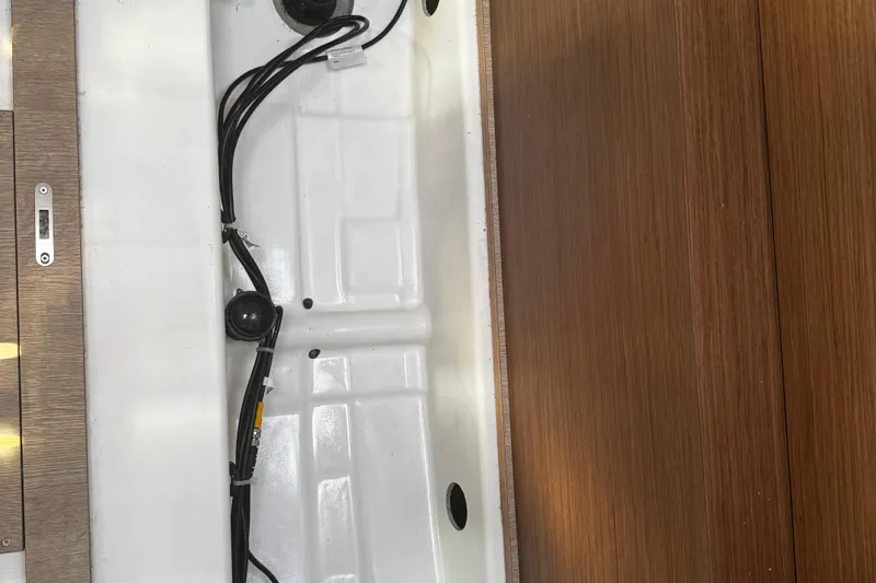 Slide: The Image of Winch and rope setup on 2023 Beneteau Oceanis 38.1 sailboat deck. - 39