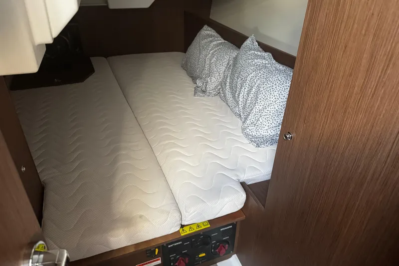 Slide: The Image of 2023 Beneteau Oceanis 38.1 interior with modern kitchen, cozy seating, and elegant design. - 46