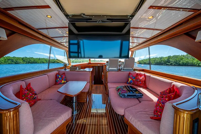Slide: The Image of Luxurious interior of 2021 Hinckley Talaria 55 Flybridge MKII yacht with plush seating and scenic views. - 23