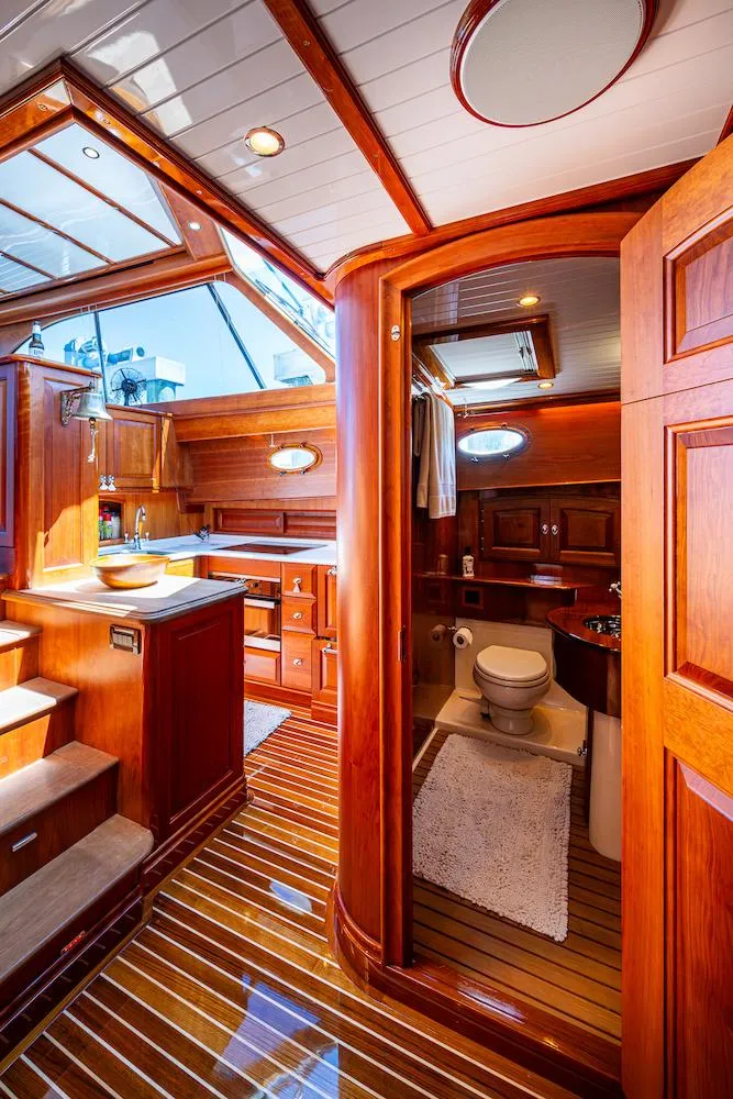 Slide: The Image of Luxurious interior of 2021 Hinckley Talaria 55 Flybridge MKII yacht with wooden finishes. - 29
