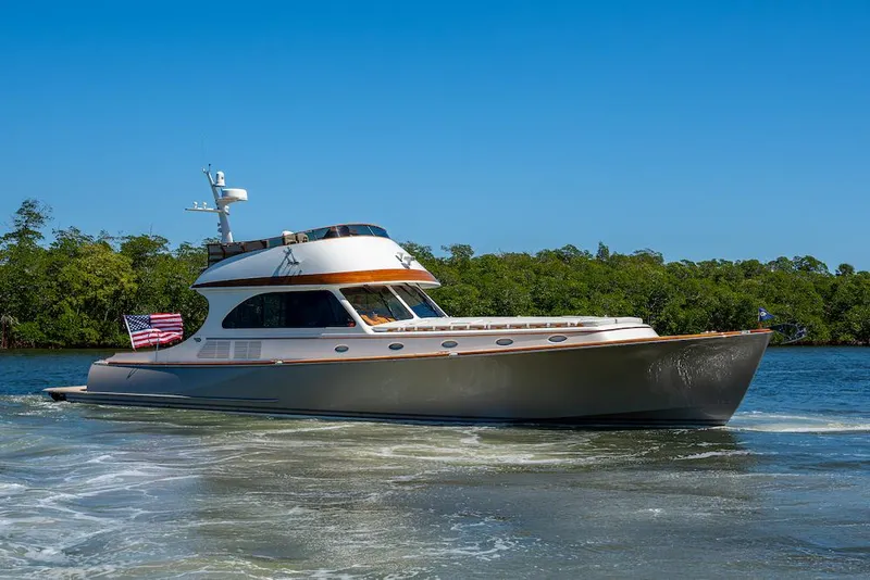 Slide: The Image of 2021 Hinckley Talaria 55 Flybridge MKII yacht cruising on a sunny day. - 3