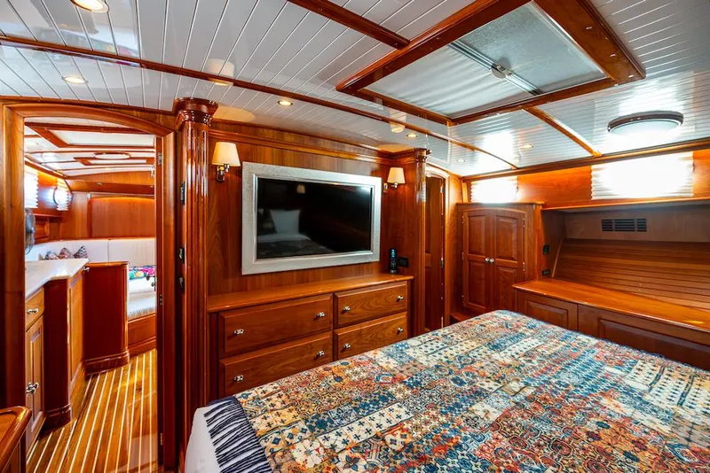 Slide: The Image of Luxurious cabin interior of 2021 Hinckley Talaria 55 Flybridge MKII yacht with wood finish. - 32