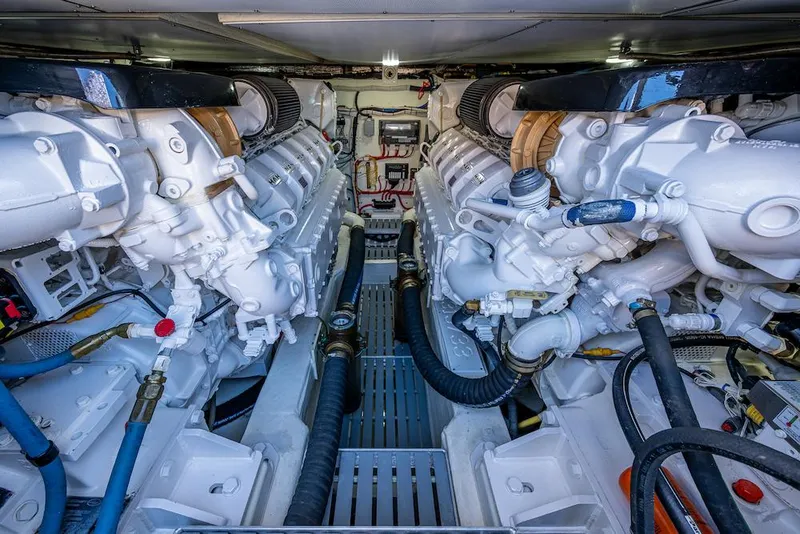 Slide: The Image of Engine room of 2021 Hinckley Talaria 55 Flybridge MKII, showcasing dual powerful engines. - 38