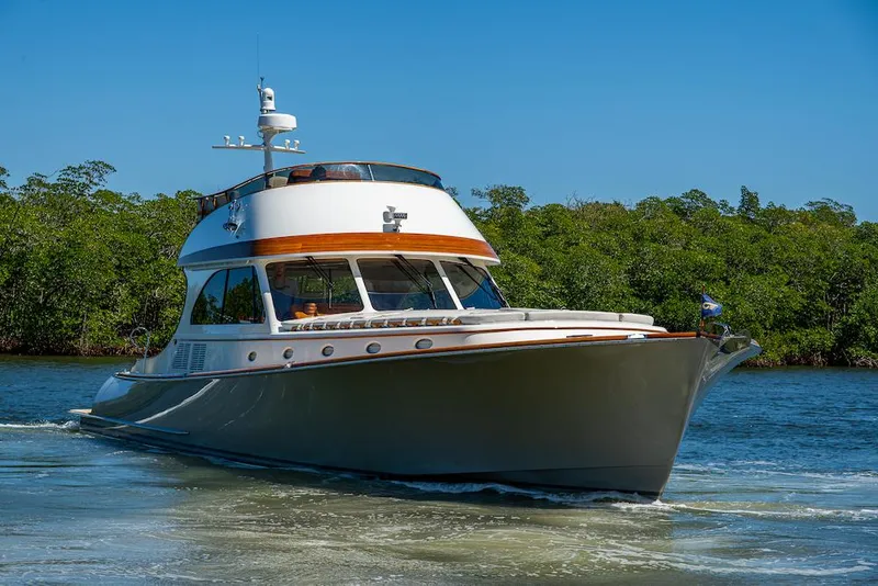 Slide: The Image of 2021 Hinckley Talaria 55 Flybridge MKII yacht cruising on a sunny day. - 4