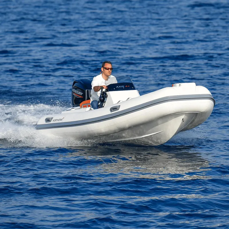 Slide: The Image of 2022 Northstar Axis 4.2 boat cruising on open water. - 8