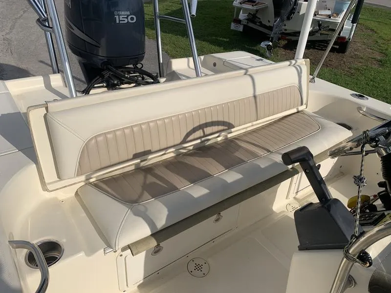 Slide: The Image of 2003 Scout 177 Sportfish boat interior with Yamaha 150 engine, featuring beige seating. - 12