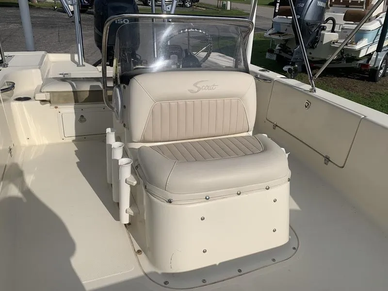 Slide: The Image of 2003 Scout 177 Sportfish boat interior with beige seating and steering console. - 19
