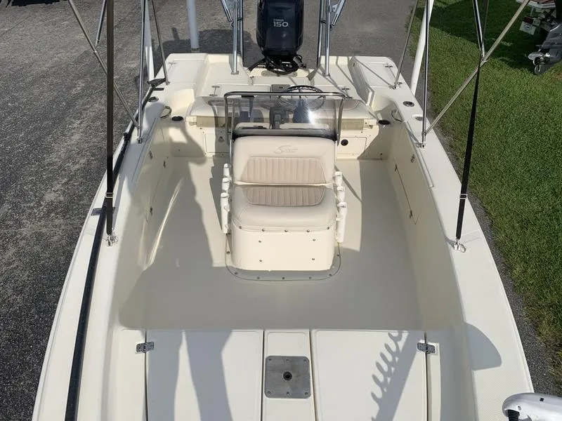 Slide: The Image of 2003 Scout 177 Sportfish boat interior with seating and steering console. - 22