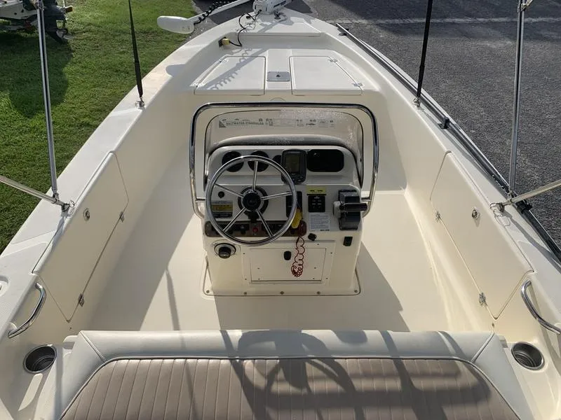 Slide: The Image of 2003 Scout 177 Sportfish boat interior with steering console and seating. - 9